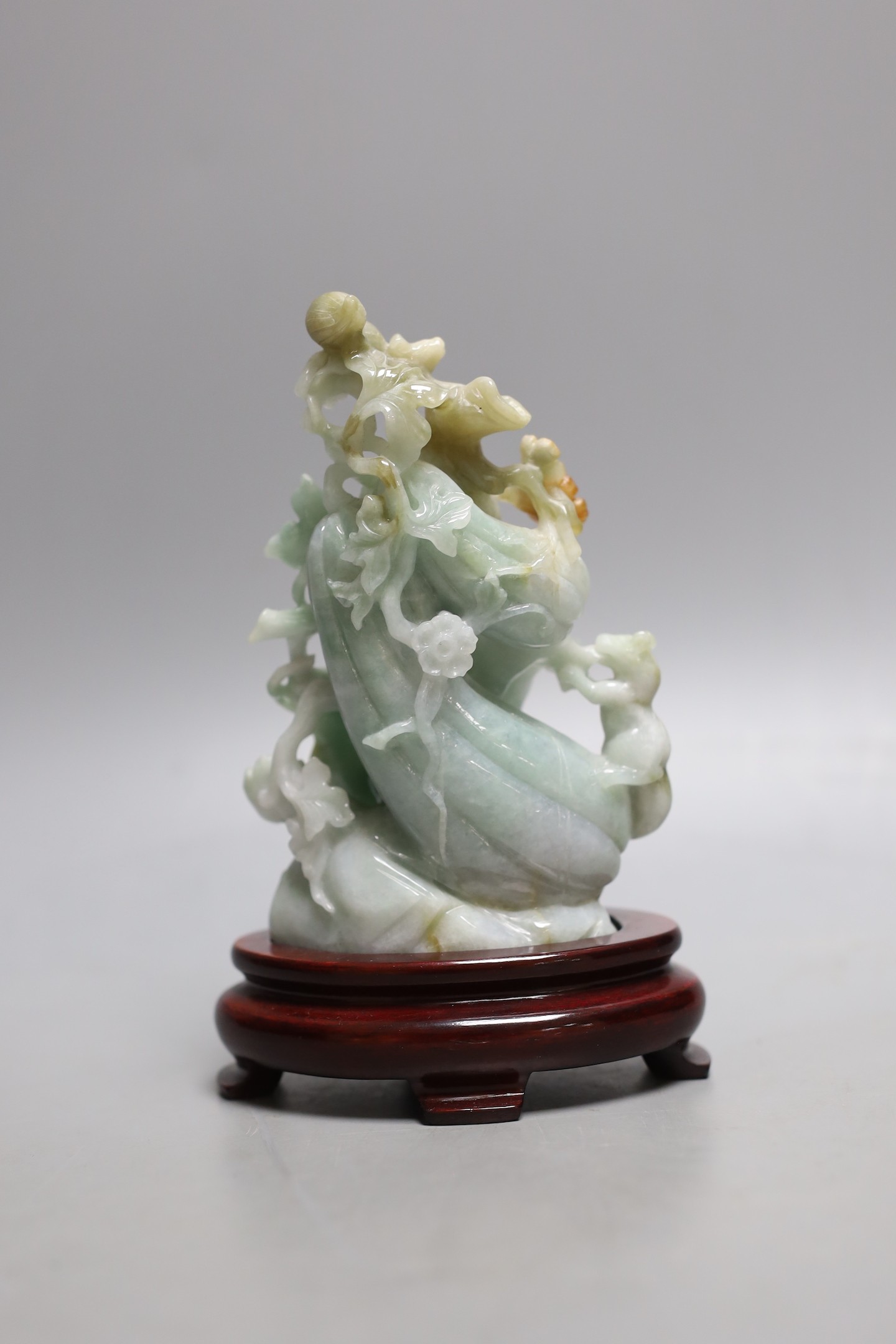 A Chinese jadeite carving of bitter melons on hardwood stand 16cm